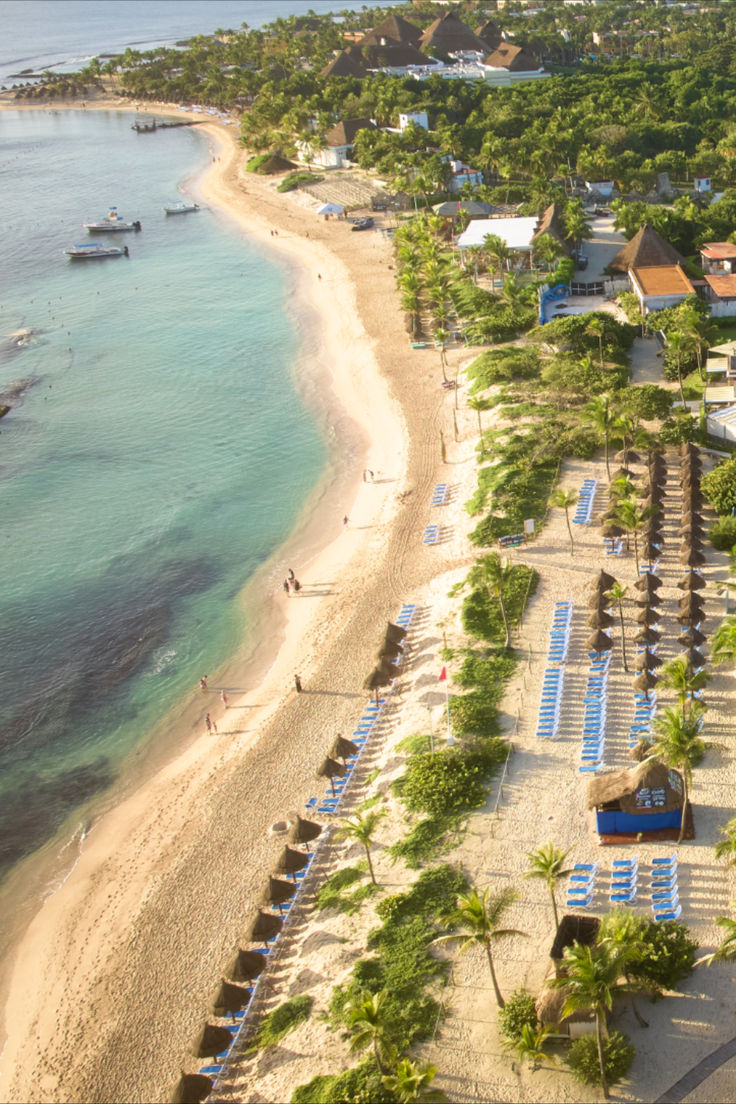 an aerial view of the beach and resort