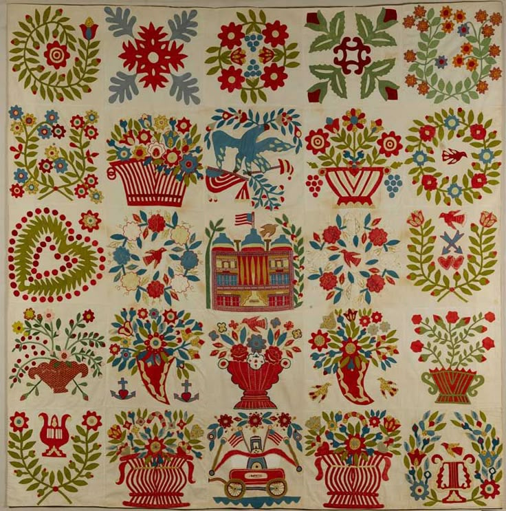 an old quilt with many different designs on it