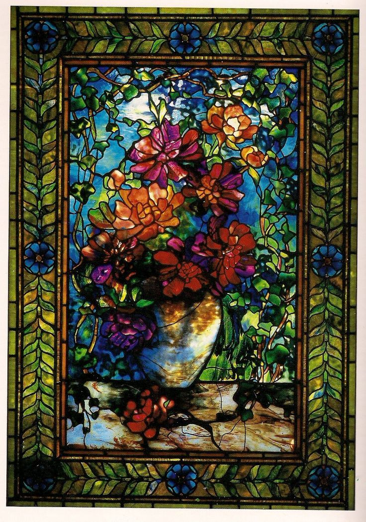 a stained glass window with flowers in it