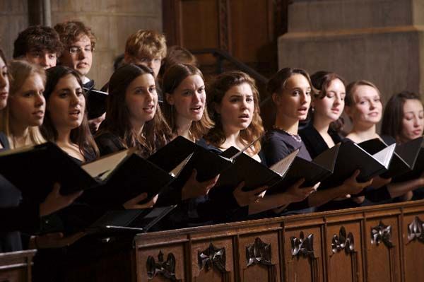 a group of people that are standing in front of a choir