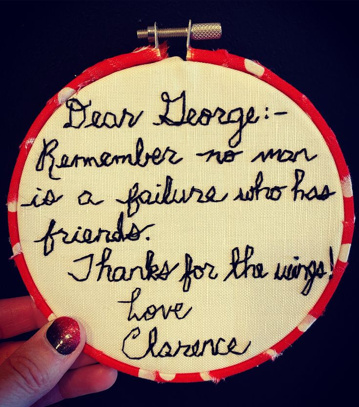 someone is holding up a small embroidered hoop with writing on it that reads dear george, remember no man as a pelture who has friends for the