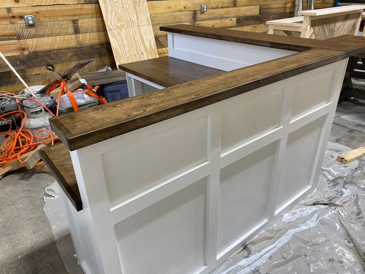 an unfinished kitchen counter being built in a shop