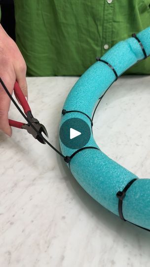 someone is making a snake out of felt