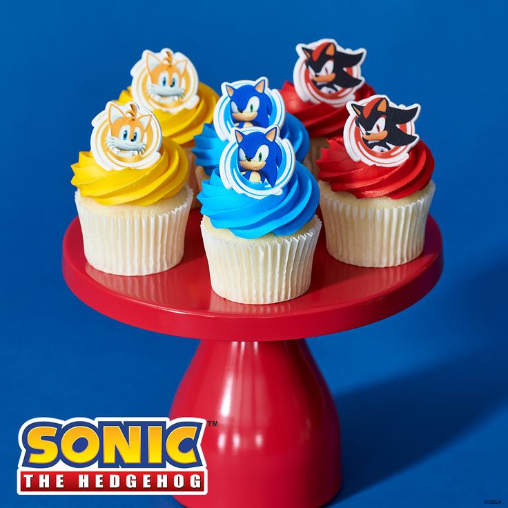 cupcakes with sonic the hedgehog icing on a red cake platter