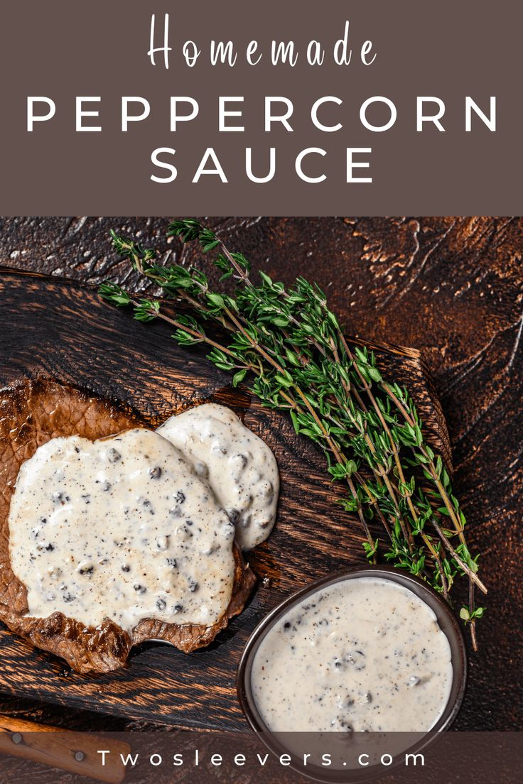 homemade peppercorn sauce is on top of two pieces of bread and sprigs of herbs