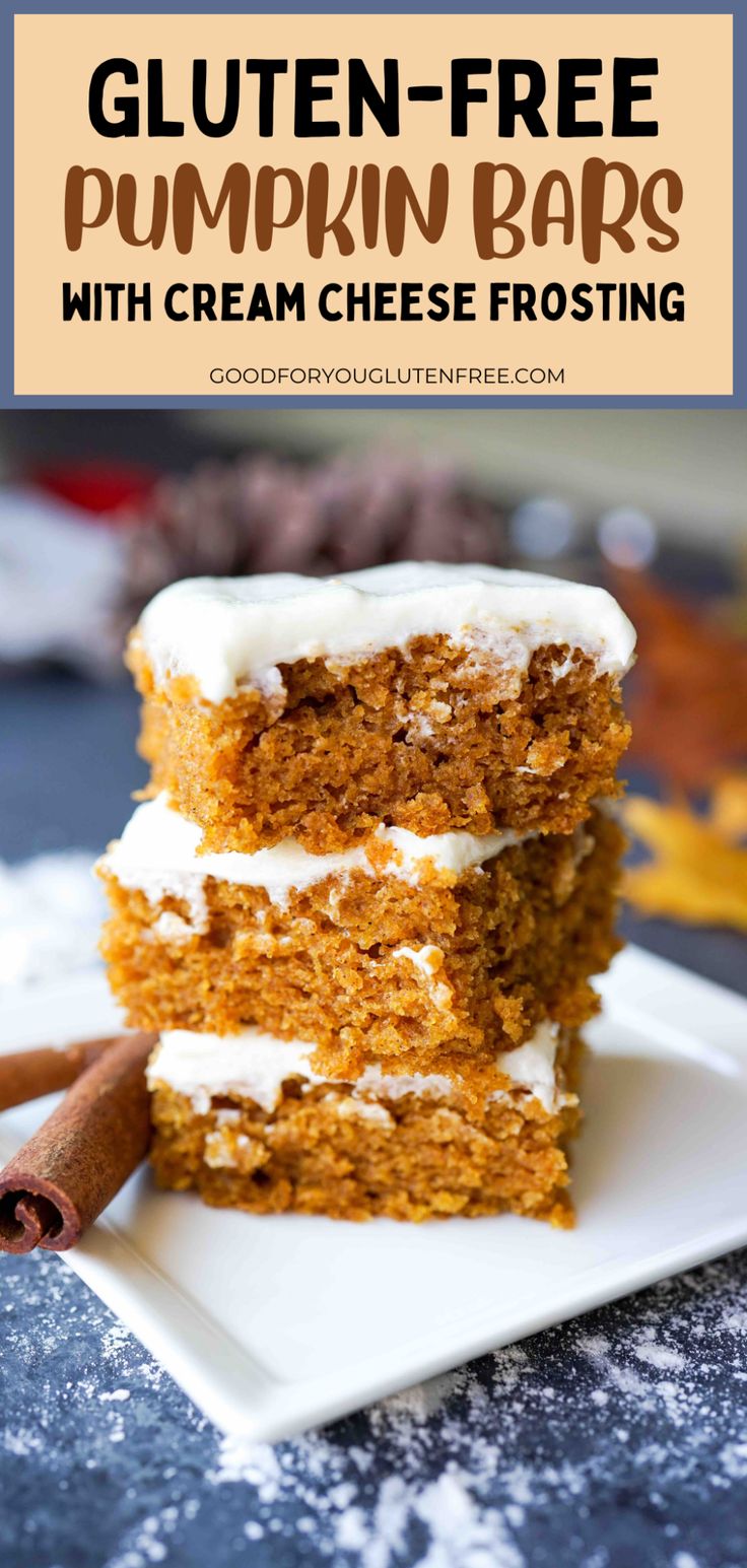 two slices of gluten - free pumpkin bars with cream cheese frosting on a white plate