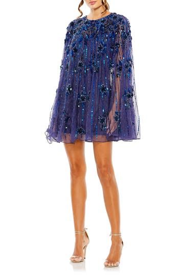 Showered in sparkle and cut to a leggy length, this fun-to-wear dress will be a smash from the first toast to the last dance. 35" length Jewel neck Long sleeves Lined 100% polyester Spot clean Imported Asian Owned/Founded Sheer Cape, Floral Cocktails, Floral Cocktail Dress, Winter Formal, Cape Sleeves, Trapeze Dress, Jewel Neckline, High Quality Dress, Mac Duggal