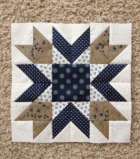 a blue and white patchwork star quilt