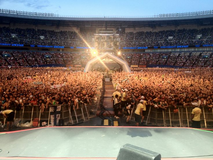 a large crowd at a concert in an arena