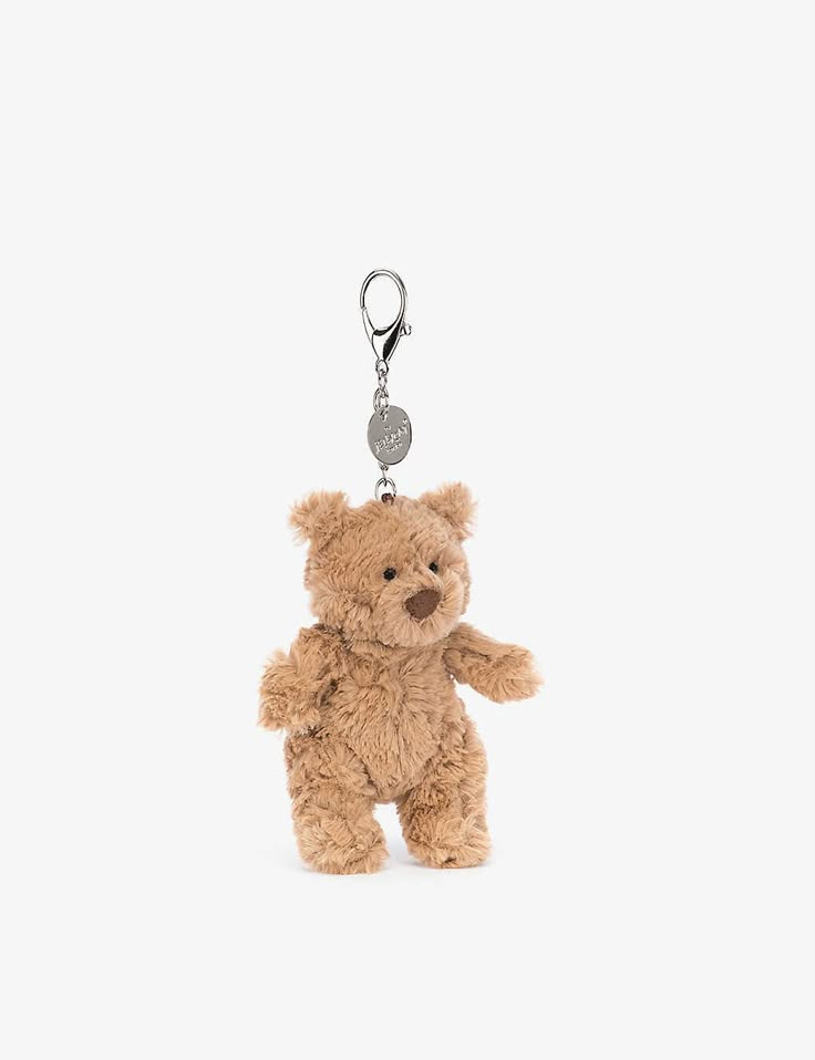 a brown teddy bear with a heart shaped tag on it's keychain