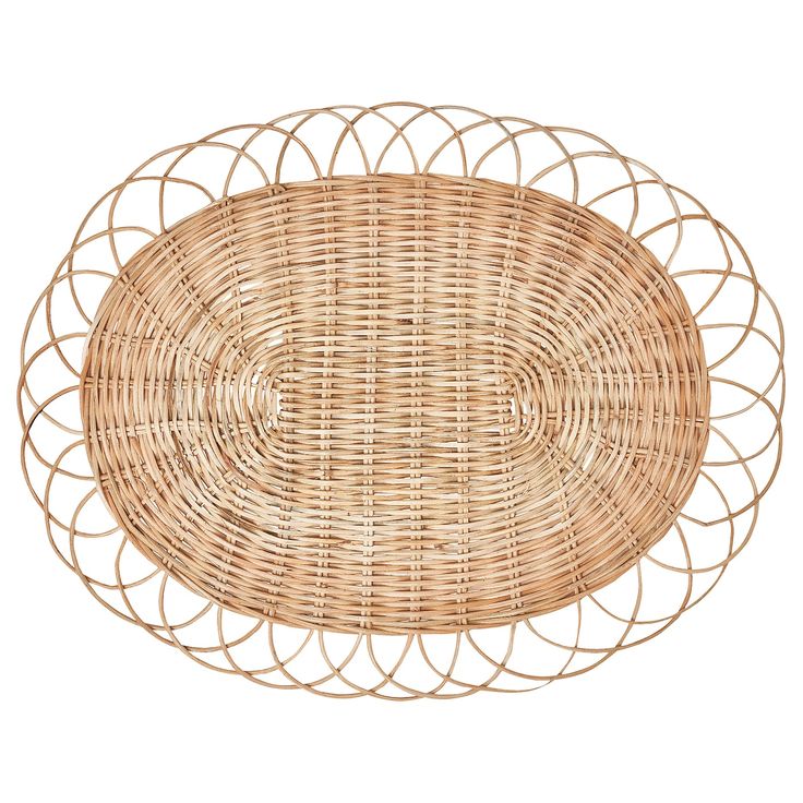 a round wicker tray with an oval design on the top and bottom, made out of