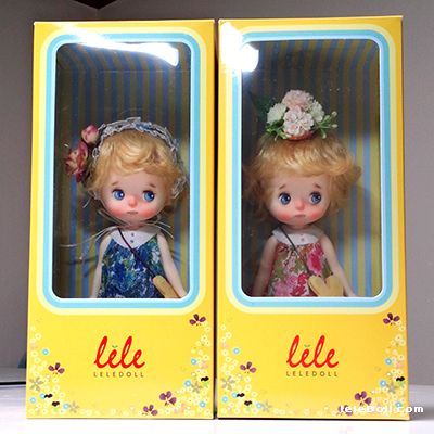 two little dolls are in the same box