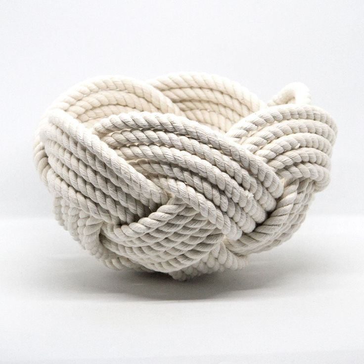 a white rope ball is shown on a white surface with no other object in the background