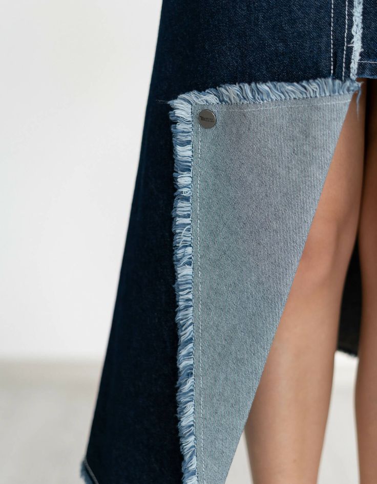 Wrap skirt is made from summer denim, A-line silhouette. In front there is a decorative scent, a zipper on the back. There are pockets.Product parameters:XS at the waist 24in/61.5 cm, at the hips 38in/97 cmS at the waist 26in/65.5 cm, at the hips 39,8in/101 cmM at the waist 27,4in/69.5 cm, at the hips 41,4in/105 cmML at the waist 29in/73.5 cm, at the hips 43in/109 cmLength from the waist to the back 35,4in/90 cmLength from the side 33in/84 cm.The model is wearing an XS size. Model's height: 168 Chic Dark Wash Denim Skirt With Pockets, Spring Asymmetrical Denim Skirt With Pockets, Fitted Denim Skirt With Five Pockets For Summer, Fitted Five Pocket Denim Skirt For Summer, Summer Fitted Denim Skirt With Five Pockets, Denim Mini Skirt With Frayed Hem, Blue Asymmetrical Denim Skirt With Pockets, Denim Blue Asymmetrical Skirt With Pockets, Spring Denim Blue Skirt With Five Pockets