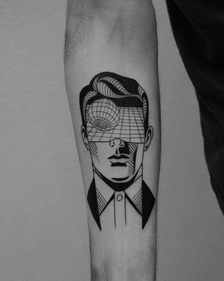 a man's arm with a black and white portrait on it