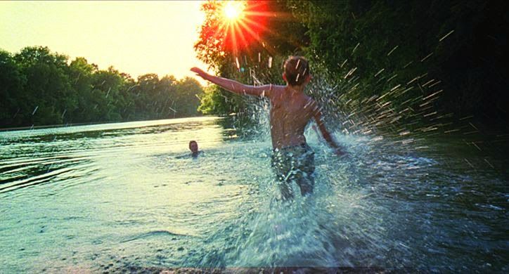 a man is splashing water in the river