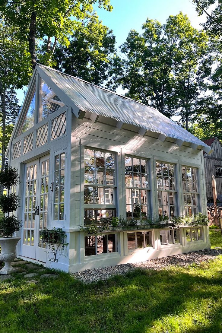 a small white house with lots of windows