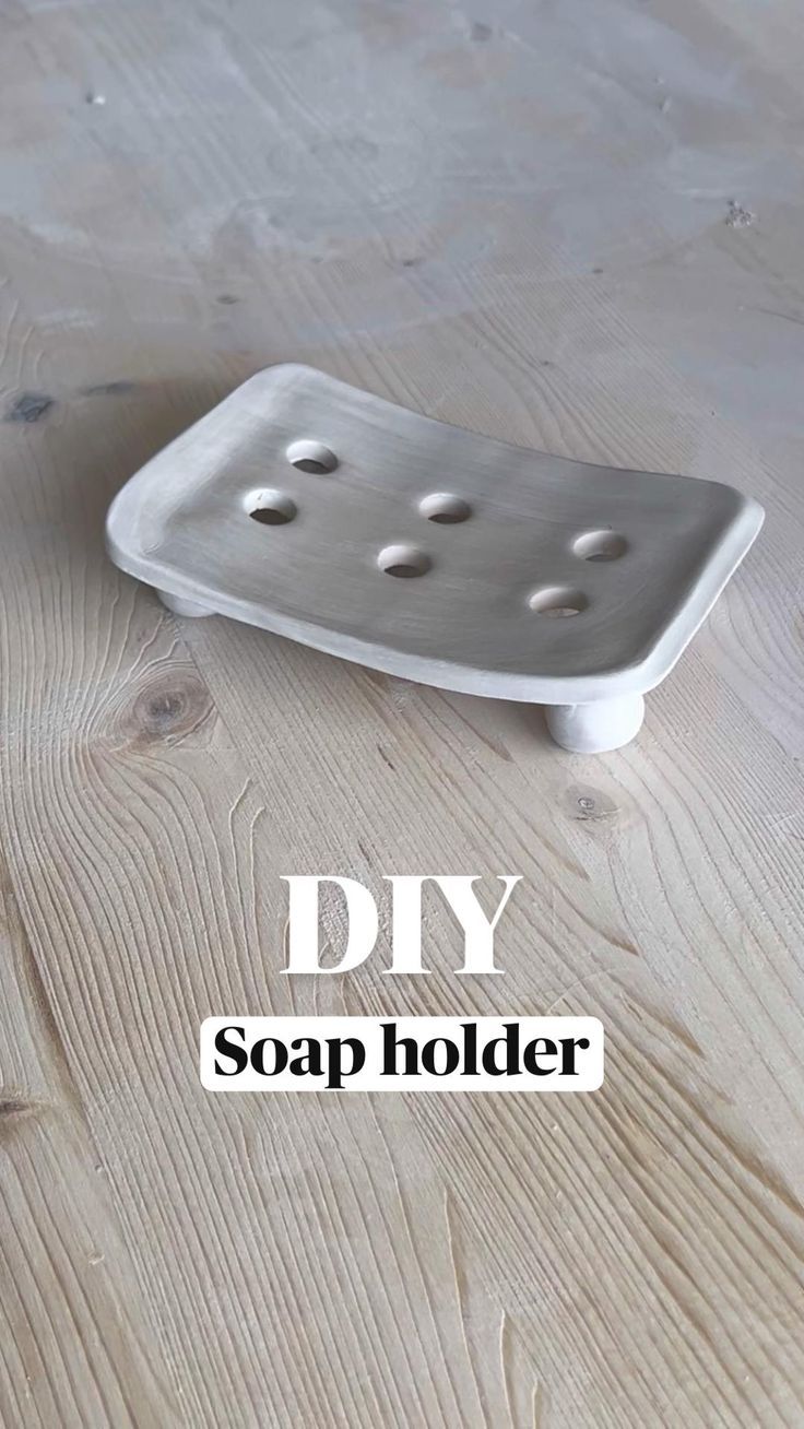 a soap holder sitting on top of a wooden floor with the words diy soap holder above it