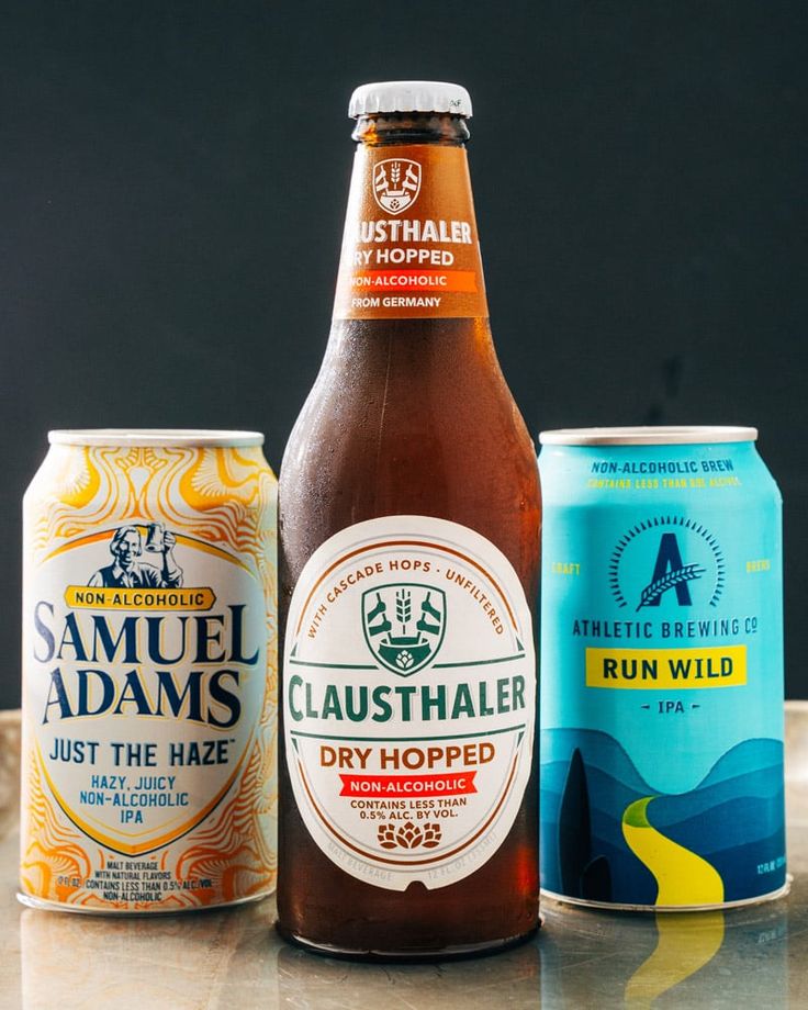 three different types of beer on a table