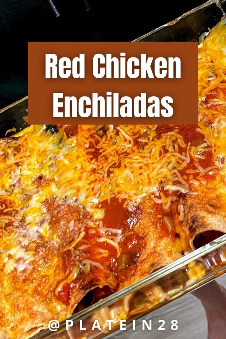 red chicken enchiladas in a casserole dish with cheese on top