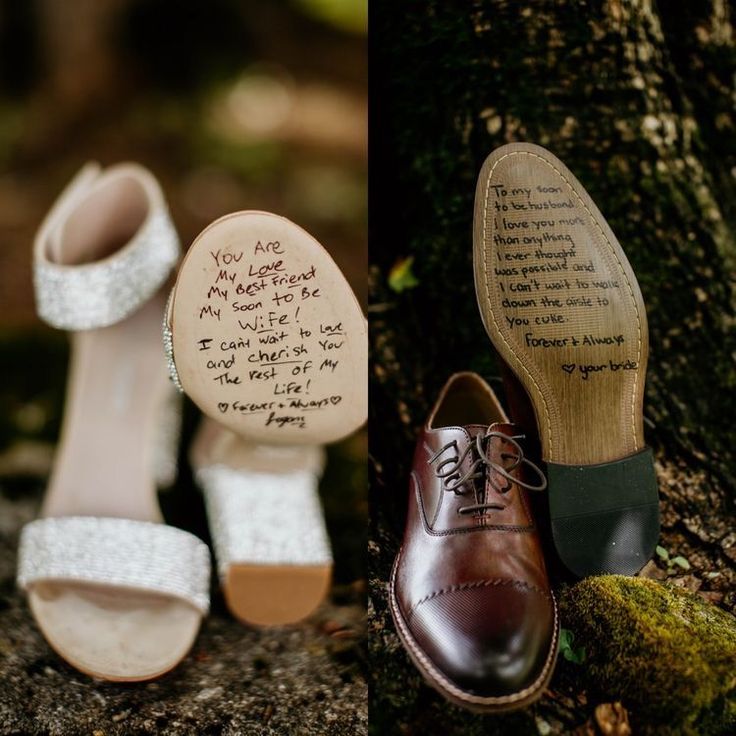 two different shoes with writing on them next to a tree and another pair of shoes