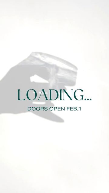 a hand holding something with the words loading doors open fb 1 on it's side