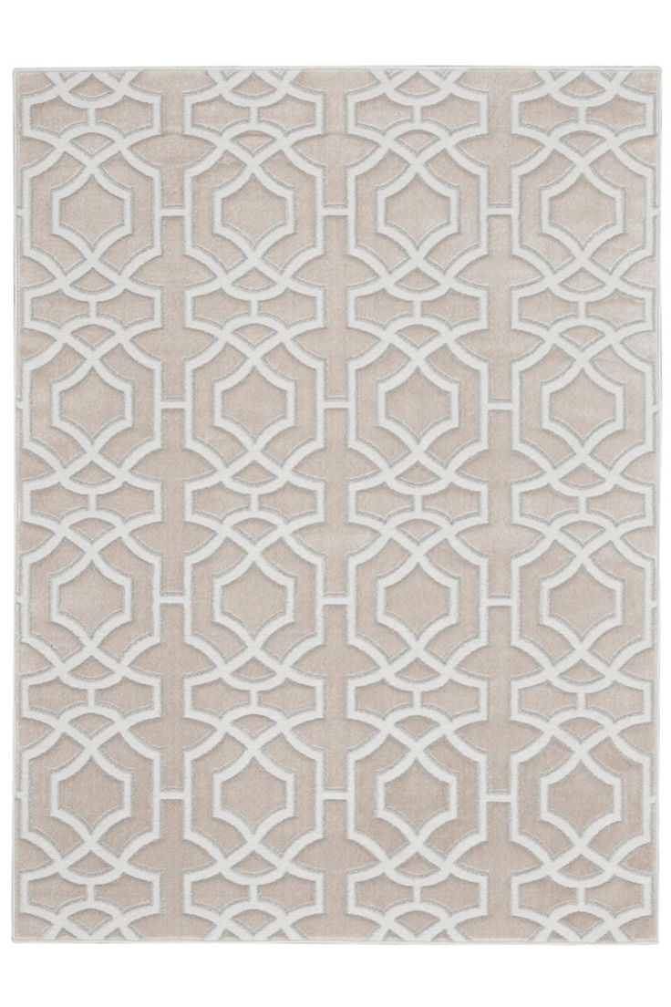 a beige and white rug with an intricate design