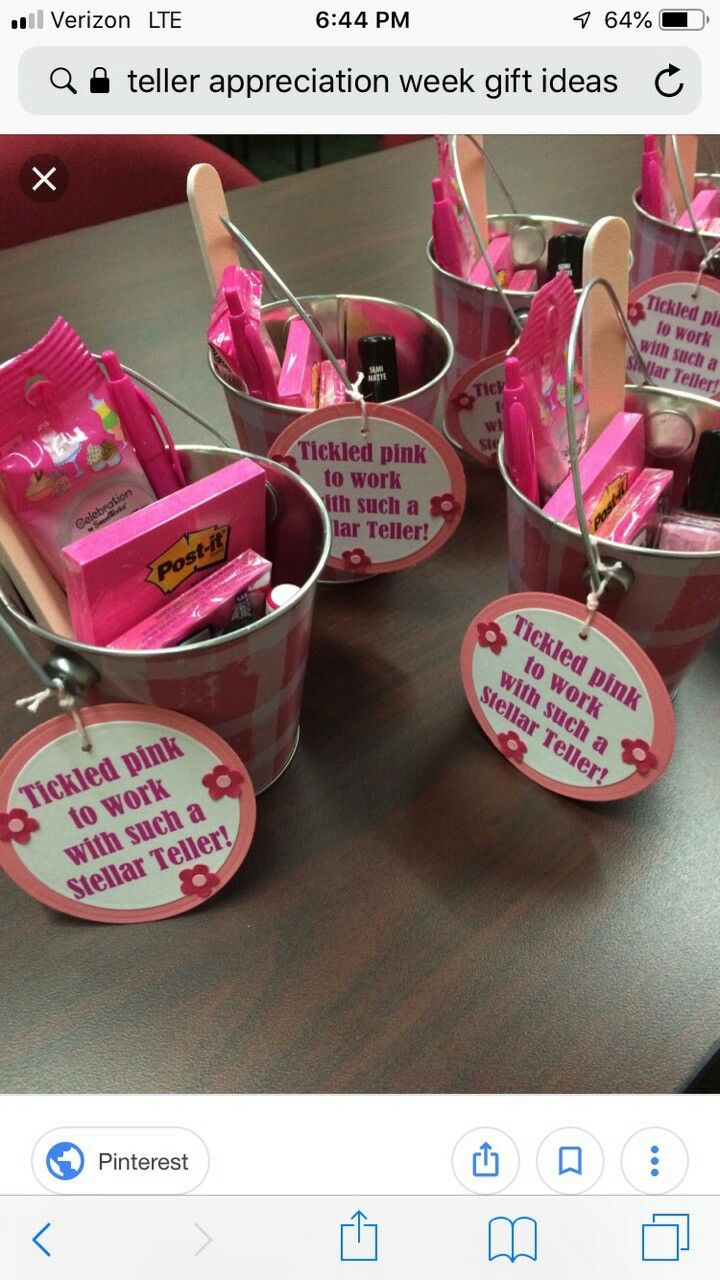 several buckets filled with pink items on top of a table