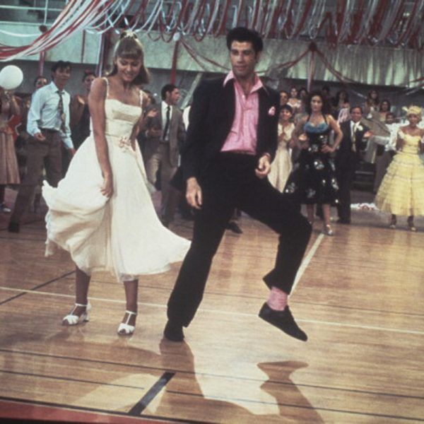 a man and woman dancing on a dance floor in front of an audience at a wedding