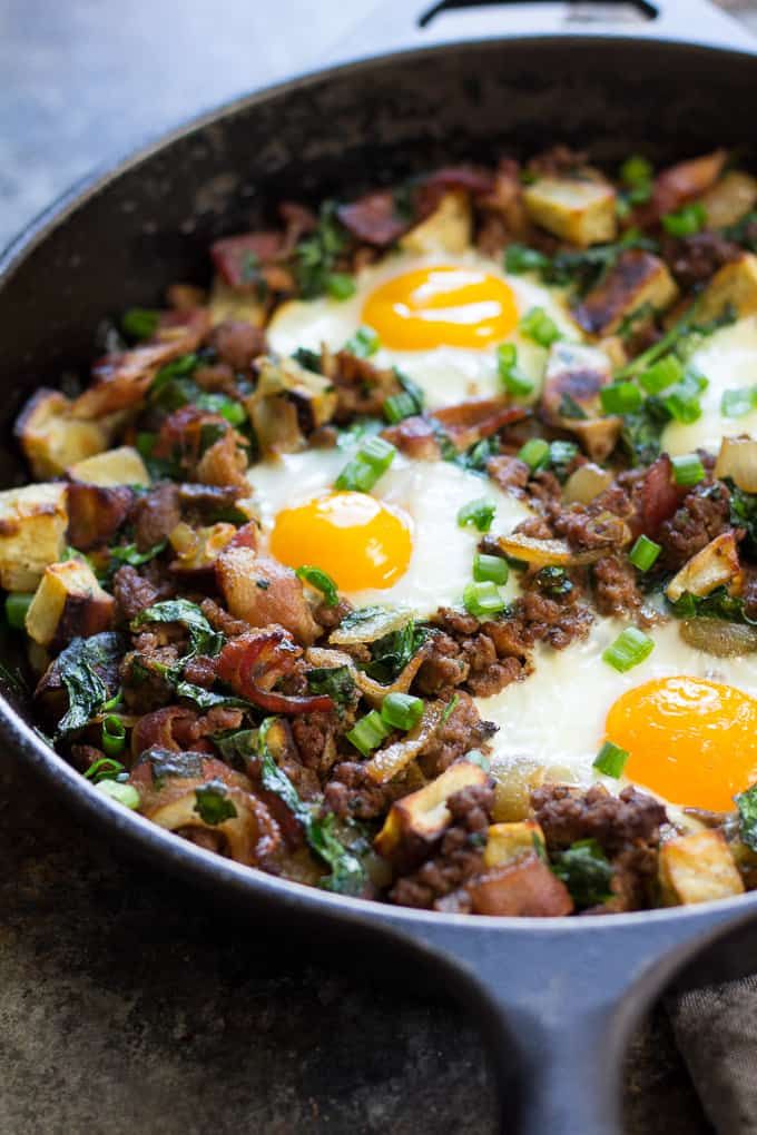 an iron skillet filled with eggs and meat