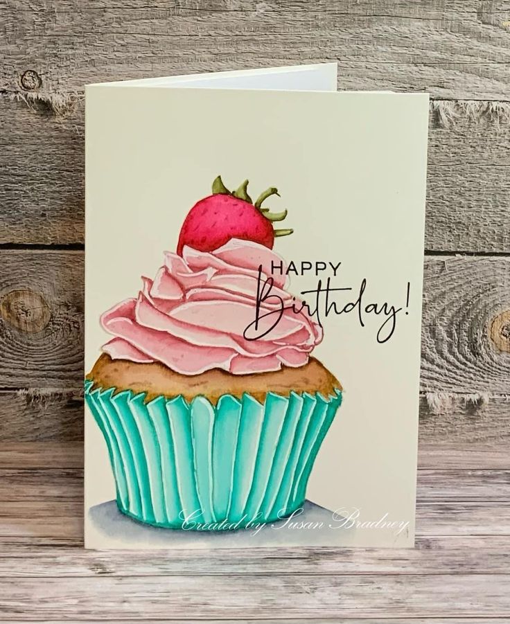 a birthday card with a cupcake and a strawberry on top that says happy birthday