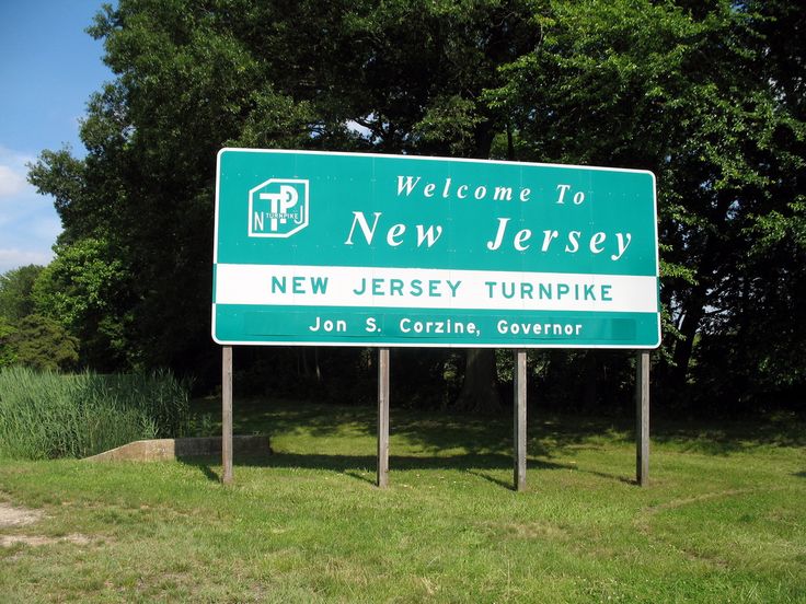 a welcome sign for the new jersey turnipie in front of trees and grass