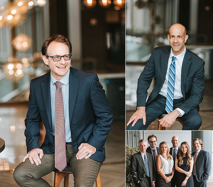 a man in a suit and tie sitting on a chair next to other people wearing suits