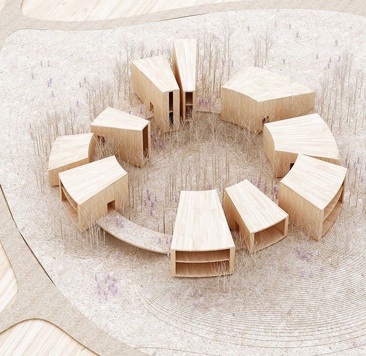 a circular arrangement of wooden structures sitting on top of a floor