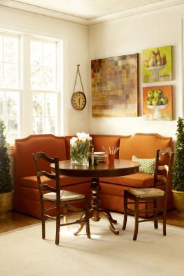 a living room filled with furniture and a sale sign on the wall above it's windows