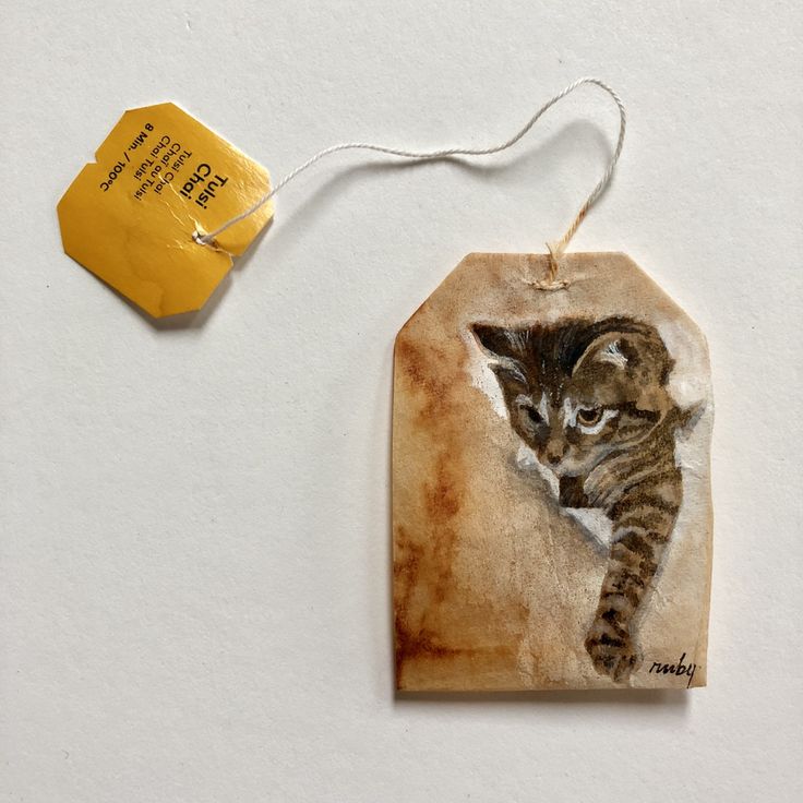 a small tag with a kitten on it