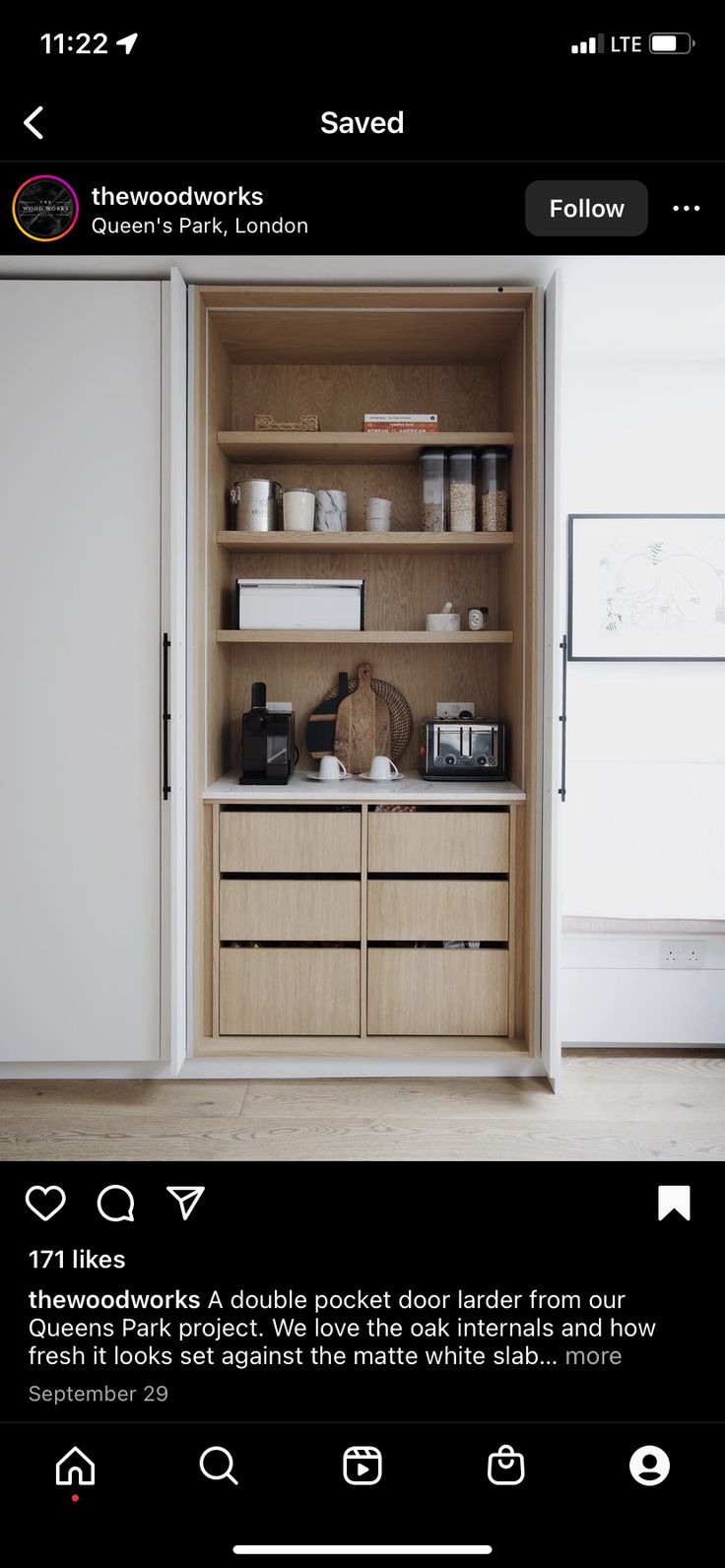 an open cabinet in the middle of a room