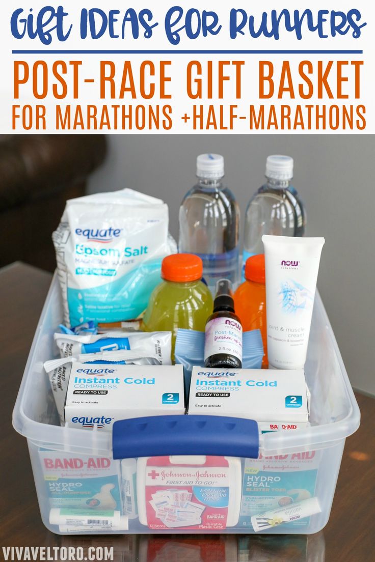 a plastic container filled with lots of different items on top of a wooden table and text overlay that says get ideas for runners post - race gift basket for marathons