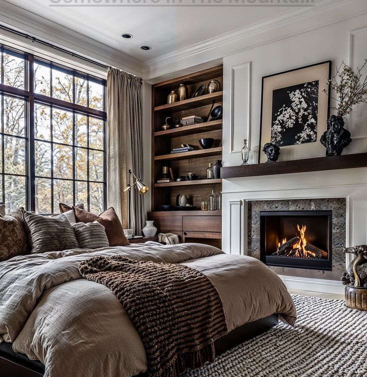 a bedroom with a bed, fireplace and windows