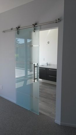 an empty room with sliding glass doors in it