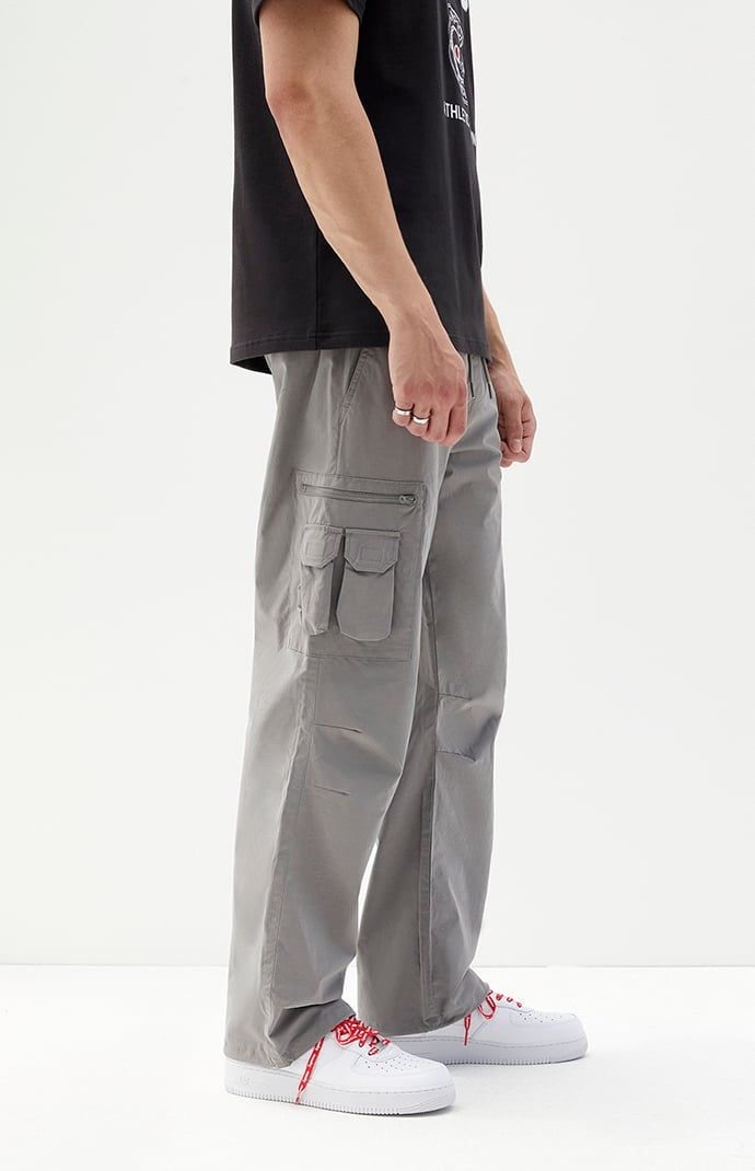 Casual meets cool with the new Stretch Gray Slim Cargo Pants from PacSun. This go-to pair is designed with an elastic stretch waistline, adjustable drawstrings, side pockets, zip cargo pockets, a drawcord hem, and a slim fit.


	Model is wearing size 32
	Model Measurements: 6'0” Height, 28” Waist, 32” Inseam


Learn more about PacSun eco items Urban Straight Leg Cargo Jeans With Elastic Waistband, Urban Cargo Jeans With Elastic Waistband, Spring Techwear Bottoms With Cargo Pockets, Summer Wide Leg Cargo Pants For Outdoor Activities, Casual Straight Parachute Pants With Cargo Pockets, Casual Cargo Pants With Patch Pockets, Gray Baggy Cargo Pants For Outdoor, Functional Straight Leg Parachute Pants With Cargo Pockets, Casual Straight Leg Cargo Pants With Multiple Pockets