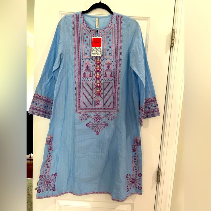 Shirt Only Ethnic Brand Brand New With Tag Medium Length Summer Shirt Color Is More Like In First Picture Bohemian Blouse With Printed Motifs For Eid, Blue Straight Kurta Tunic For Spring, Festive Blue Straight Kurta Top, Blue Straight Kurta Tops For Festive Occasions, Festive Blue Straight Kurta, Blue Kurta With Printed Motifs For Spring, Bohemian Blue Blouse For Eid, Blue Bohemian Blouse For Eid, Blue Kurta With Resham Embroidery For Spring