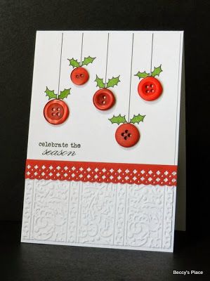 a card with buttons and holly on it