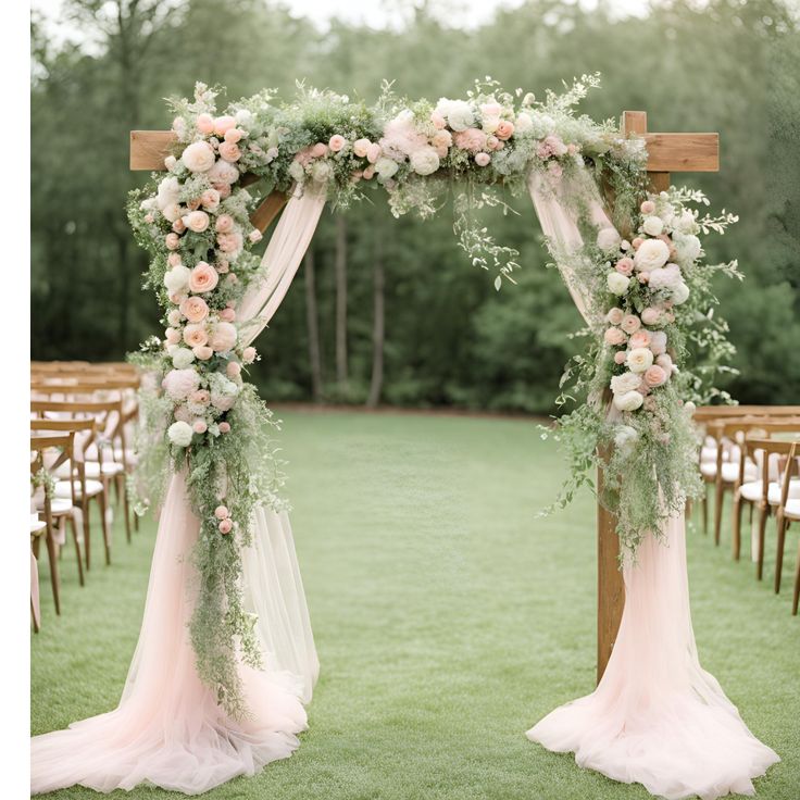 an outdoor ceremony setup with flowers and greenery