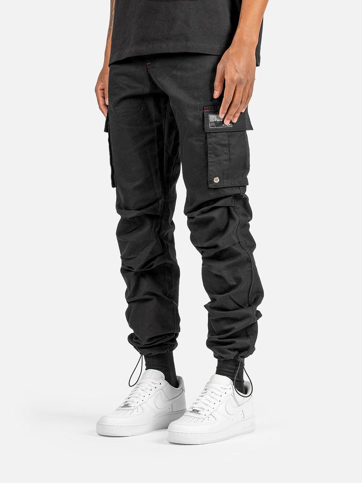 C9 Cargo Pants - Black | Blacktailor – BLACKTAILOR Urban Style Cotton Cargo Pants With Pockets, Urban Cotton Cargo Pants With Pockets, Black Tapered Leg Cargo Jeans With Patch Pockets, Combat Style Cotton Bottoms With Pockets, Sporty Parachute Pants With Cargo Pockets And Tapered Leg, Utility Parachute Pants With Tapered Leg And Side Pockets, Combat Cotton Bottoms With Multiple Pockets, Cotton Combat Bottoms With Multiple Pockets, Sporty Streetwear Cargo Pants With Patch Pockets