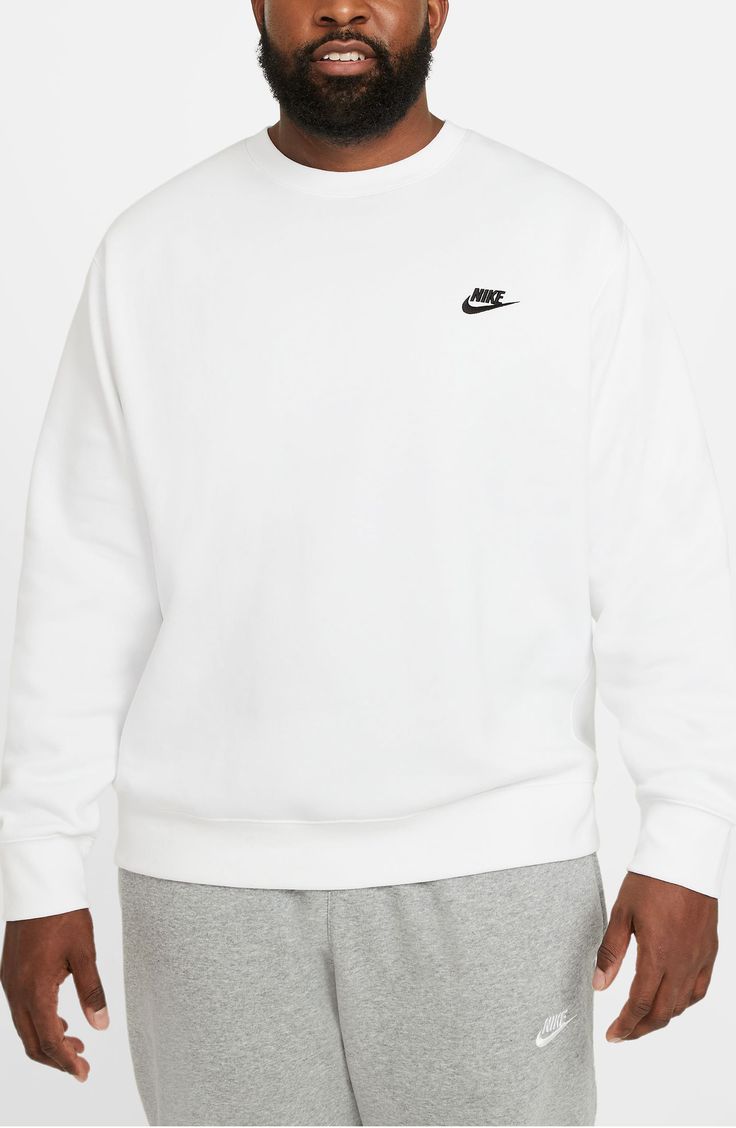 This crewneck sweatshirt cut from lightweight fleece is one you'll want in every color. 28" length (size Medium) Crewneck Long sleeve 80% cotton, 20% polyester Machine wash, tumble dry Imported Nike Crew Neck Sweats For Fall, Nike White Fall Sweats, Nike Fleece Crew Neck Hoodie, Nike Crew Neck Fleece Sweater, Nike Casual Crew Sweatshirt, Nike Cotton Long Sleeve Sweats, Nike Crew Neck Sweats For Winter, Nike Relaxed Fit Crew Neck Sweats, Nike Winter Crew Neck Sweats