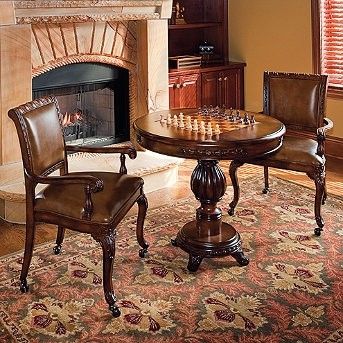 a living room filled with furniture and a fire place next to a table covered in chess pieces