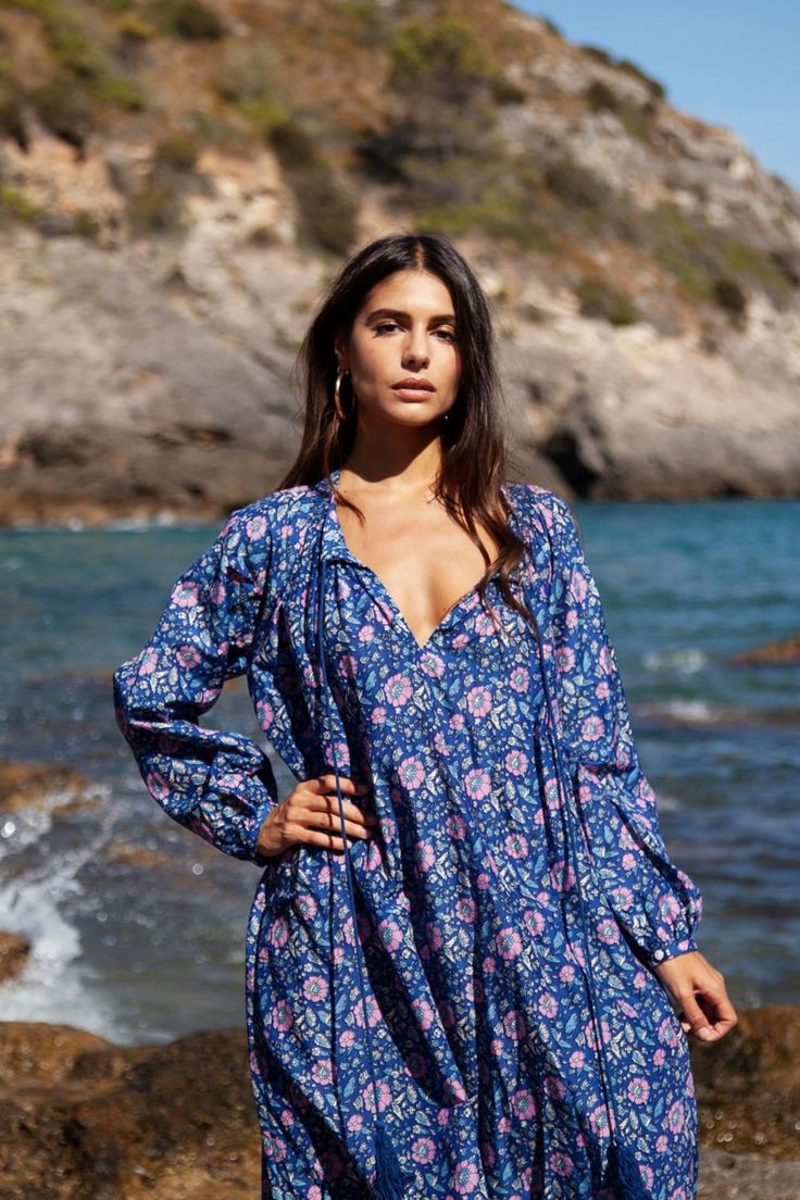 The Bella kaftan is made of light cotton silk voile and printed with vibrant florals. It has a lightweight, airy silhouette with long sleeves, button closure, and a tassel detail. This bohemian kaftan is the epitome of boho-chic style and is as elegant as it is comfortable. Vibrant Florals, Luxury Sustainable, Everyday Casual Outfits, Kaftan Dress, Boho Chic Fashion, Cotton Lights, Cotton Silk, Flat Sandals, Sustainable Fashion