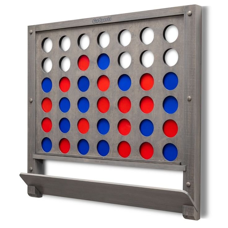 a giant four in a row game with red, white and blue dots on it