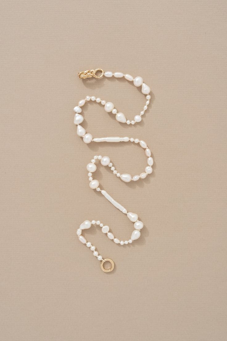 Our Petite Pearl Necklace is a natural pearl necklace composed of a mix of Keshi and Baroque Pearls strung at random, and finished with a handmade braided 14k Yellow Gold closure. The necklace is pearl knotted using cream colored silk thread, which is gives it that extra touch of sweetness, and nostalgia, while also protecting the pearls from one another. This is a petite style pearl necklace that is a great layering addition, or wonderful on its own. Floating Pearl Necklace, Natural Pearl Necklace, Petite Style, Baroque Pearl Necklace, Natural Pearl, Silk Thread, Pearl Color, Petite Fashion, Natural Pearls